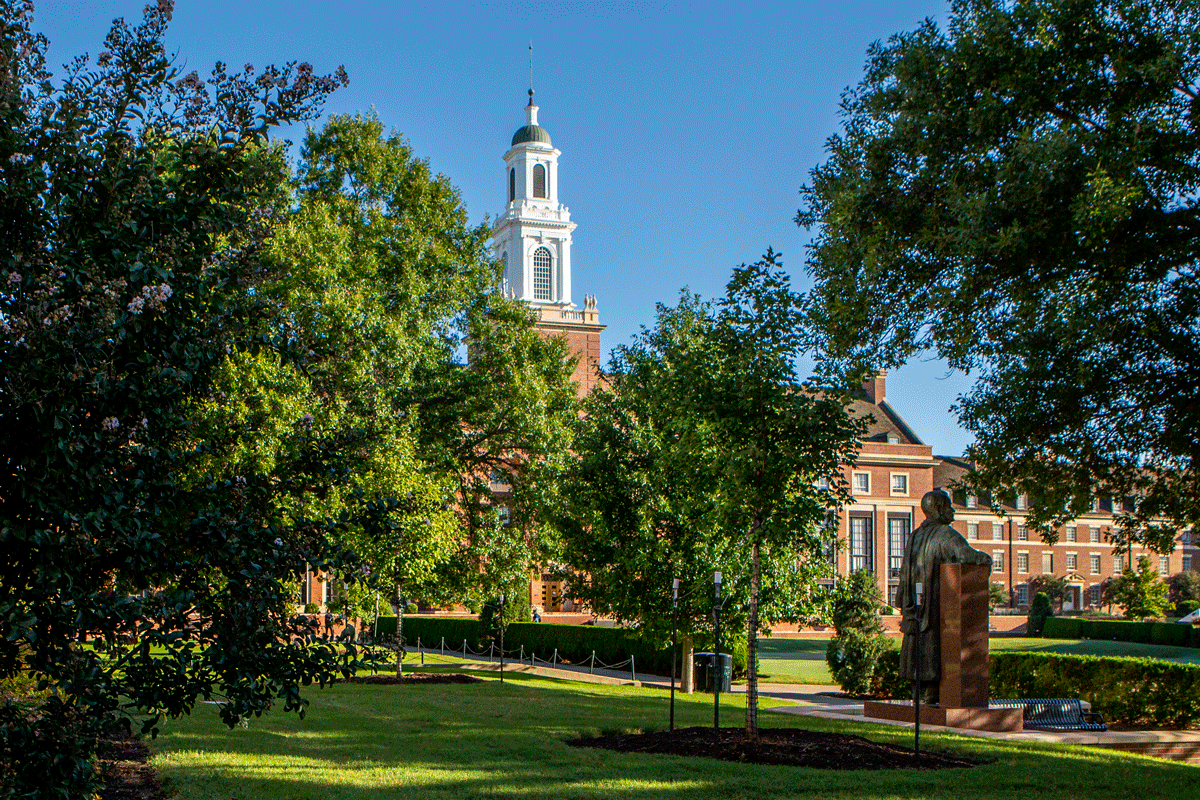 library and henry bennet statue on campus